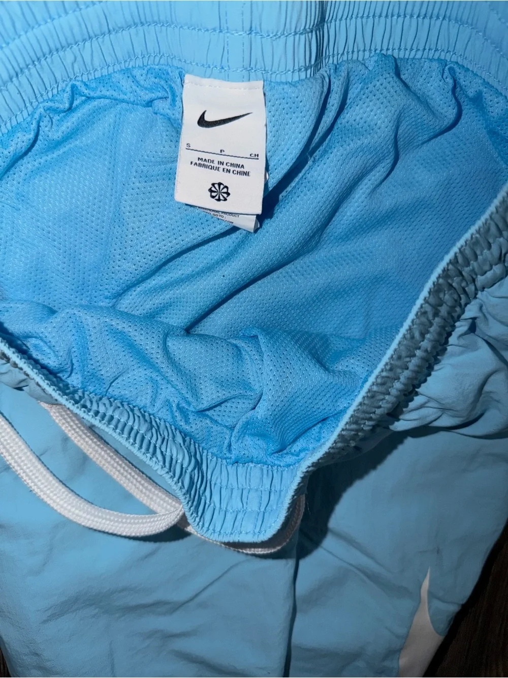 Nike sportswear mesh lined big swoosh athletic shorts light blue mens small